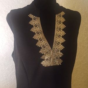 Black and gold dress. Lined and zips in the back